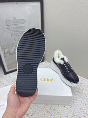 CHLOÉ 26S WEDGE SOLE SNEAKERS IN BLACK CALFSKIN