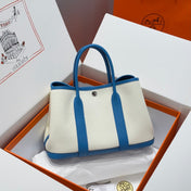 GARDEN PARTY 30CM IN WHITE TOILETS COTTON CANVAS AND BLUE CALFSKIN GREEN ON SIDE OTHER