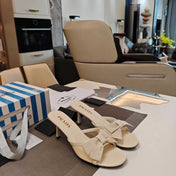 PRADA 26S HEEL MULE SANDALS 75MM IN IVORY WHITE CALFSKIN WITH BOW