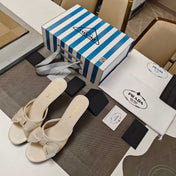 PRADA 26S HEEL MULE SANDALS 75MM IN IVORY WHITE CALFSKIN WITH BOW