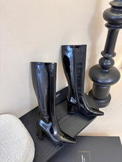 YSL 26S KNEE-HIGH HEELED BOOTS IN BLACK SHINY CALFSKIN