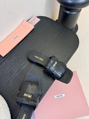 MIUMIU 26S FLAT SLIPPERS IN BLACK CALFSKIN