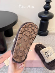 MIUMIU 26S PLATFORM SLIDES IN DARK BROWN AND BEIGE SHEARLING