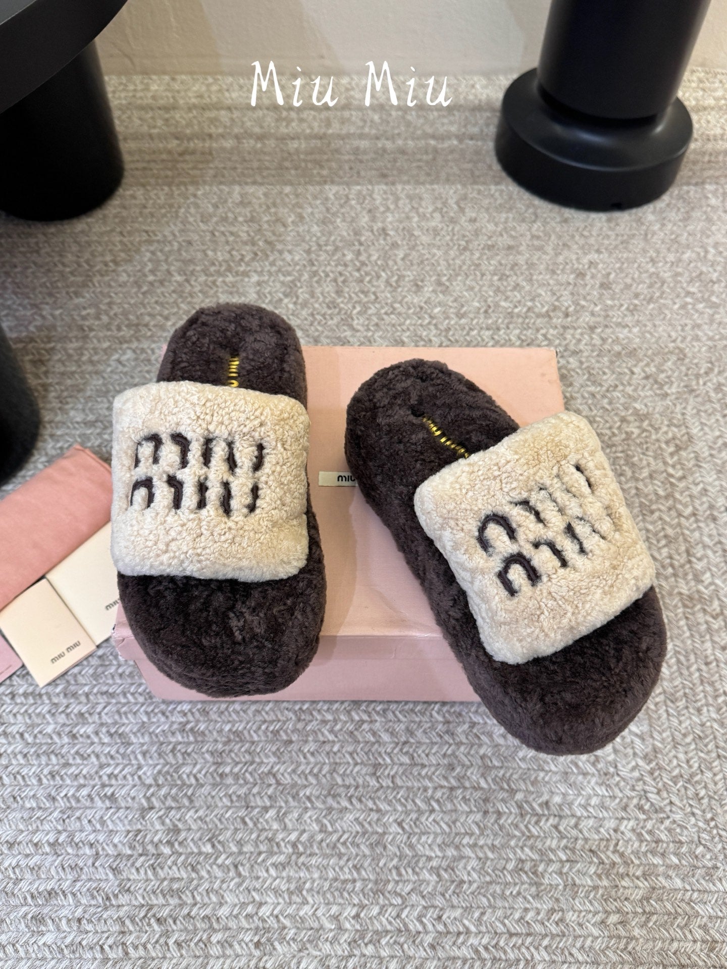 MIUMIU 26S PLATFORM SLIDES IN DARK BROWN AND BEIGE SHEARLING