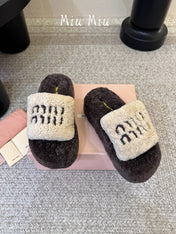 MIUMIU 26S PLATFORM SLIDES IN DARK BROWN AND BEIGE SHEARLING