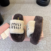 MIUMIU 26S PLATFORM SLIDES IN DARK BROWN AND BEIGE SHEARLING