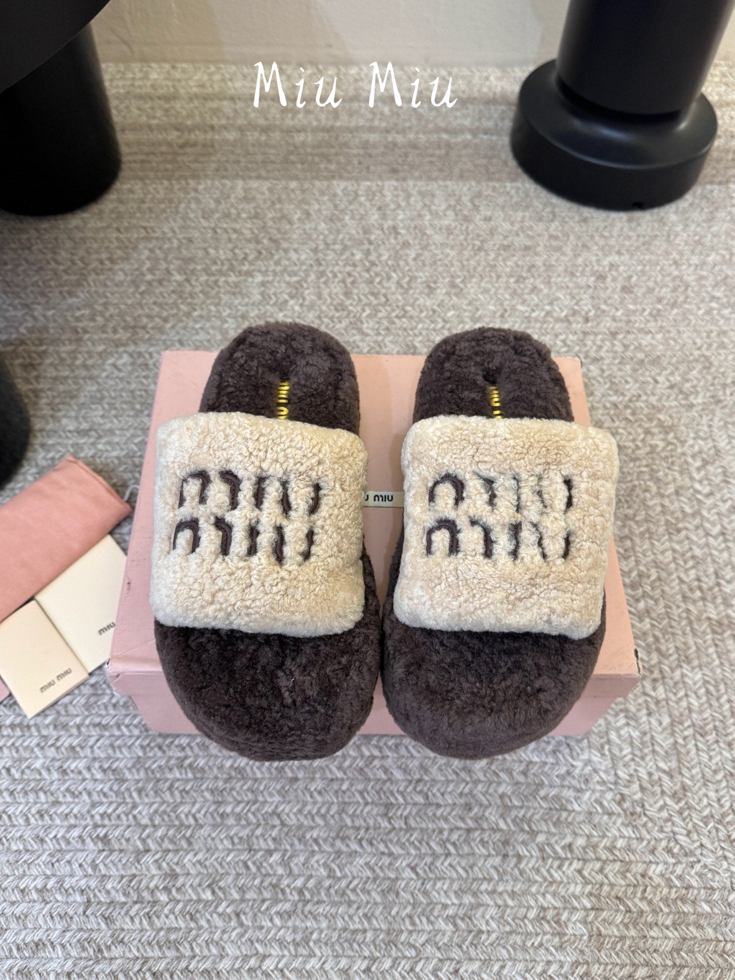 MIUMIU 26S PLATFORM SLIDES IN DARK BROWN AND BEIGE SHEARLING