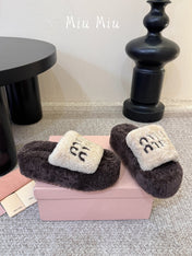 MIUMIU 26S PLATFORM SLIDES IN DARK BROWN AND BEIGE SHEARLING