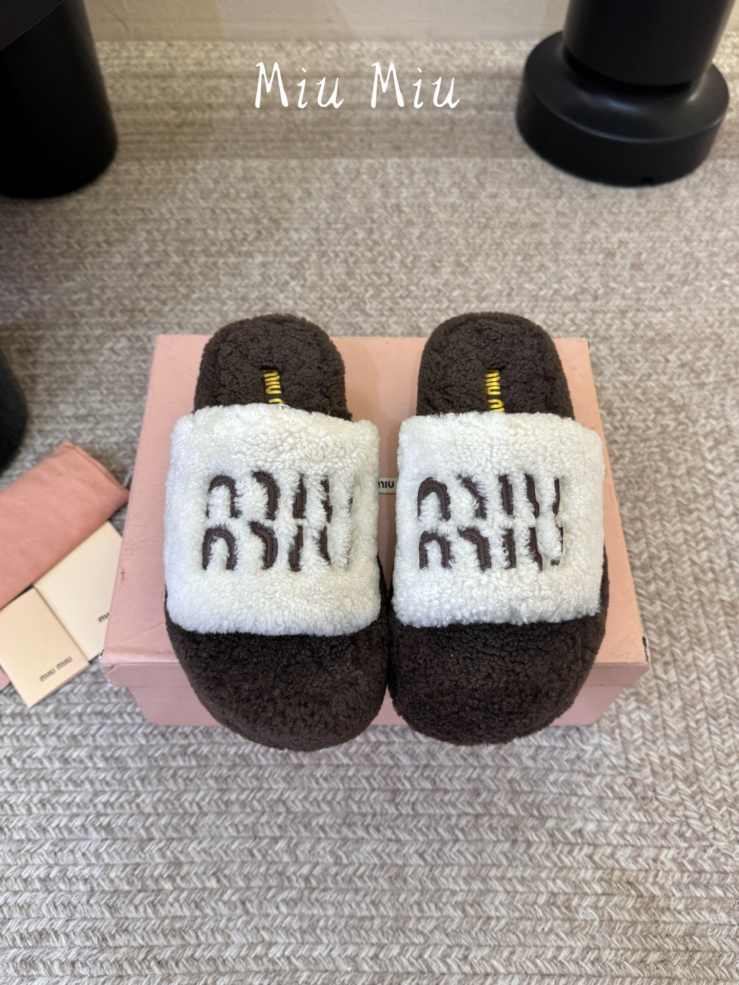 MIUMIU 26S PLATFORM SLIDES IN DARK BROWN AND WHITE SHEARLING