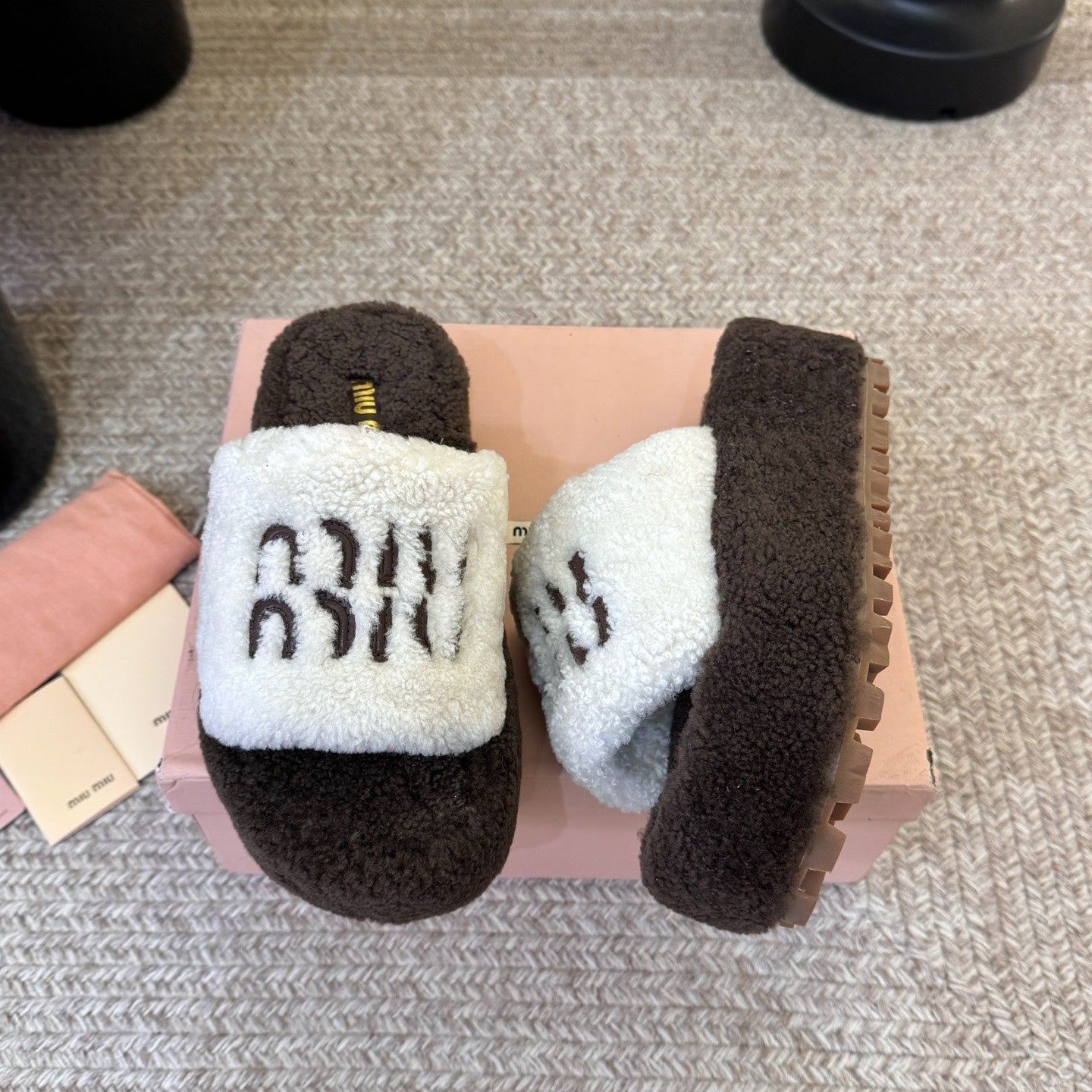 MIUMIU 26S PLATFORM SLIDES IN DARK BROWN AND WHITE SHEARLING
