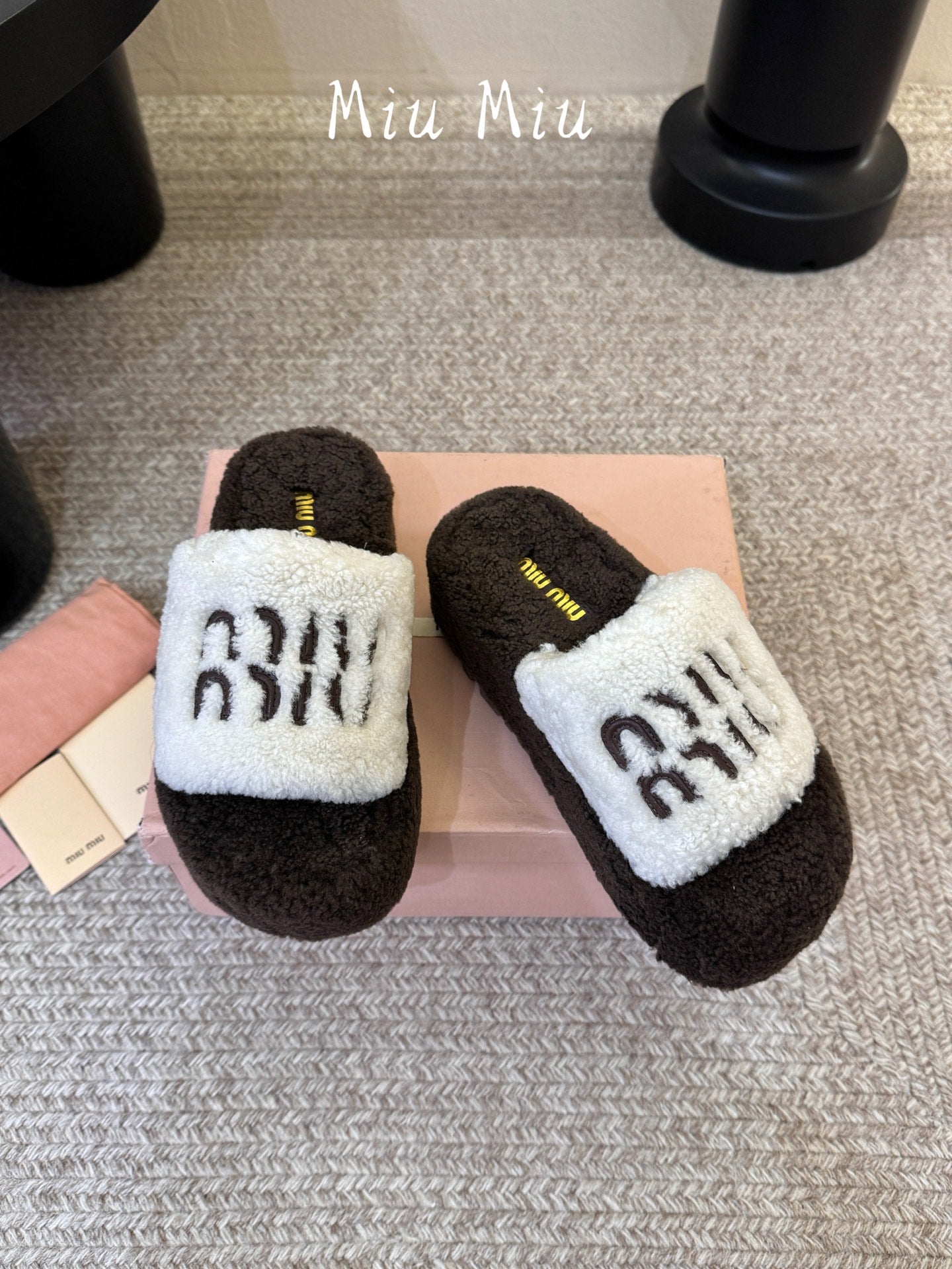 MIUMIU 26S PLATFORM SLIDES IN DARK BROWN AND WHITE SHEARLING