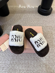 MIUMIU 26S PLATFORM SLIDES IN DARK BROWN AND WHITE SHEARLING