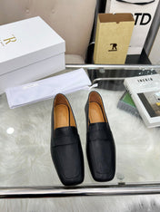THE ROW 26S PENNY LOAFER FLATS IN BLACK GRAINED CALFSKIN