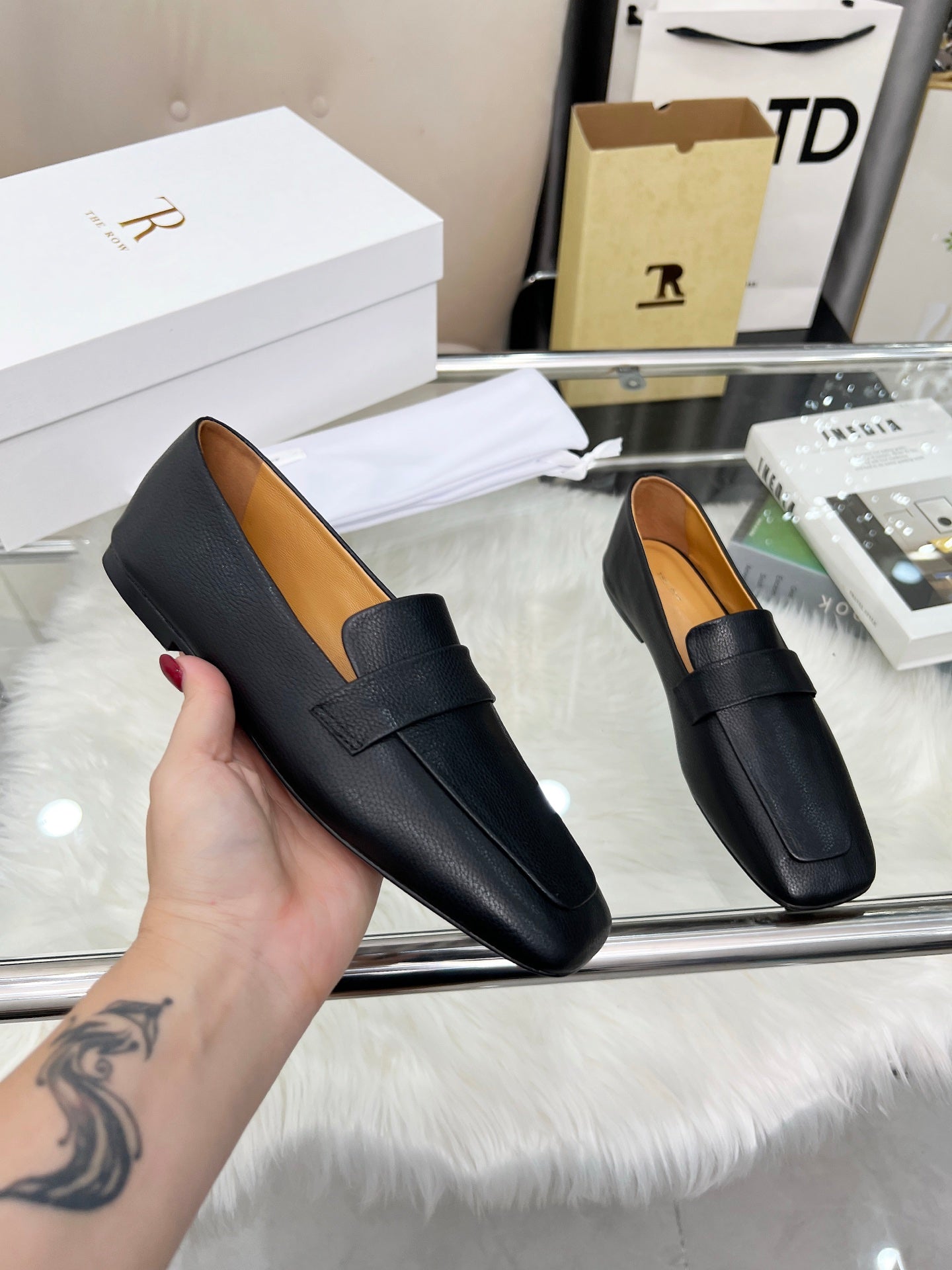 THE ROW 26S PENNY LOAFER FLATS IN BLACK GRAINED CALFSKIN