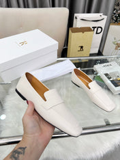 THE ROW 26S PENNY LOAFER FLATS IN IVORY WHITE GRAINED CALFSKIN