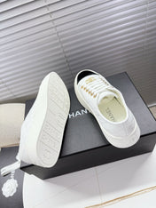 CHANEL 25S TRAINERS WHITE AND BLACK 35MM IN CALFSKIN