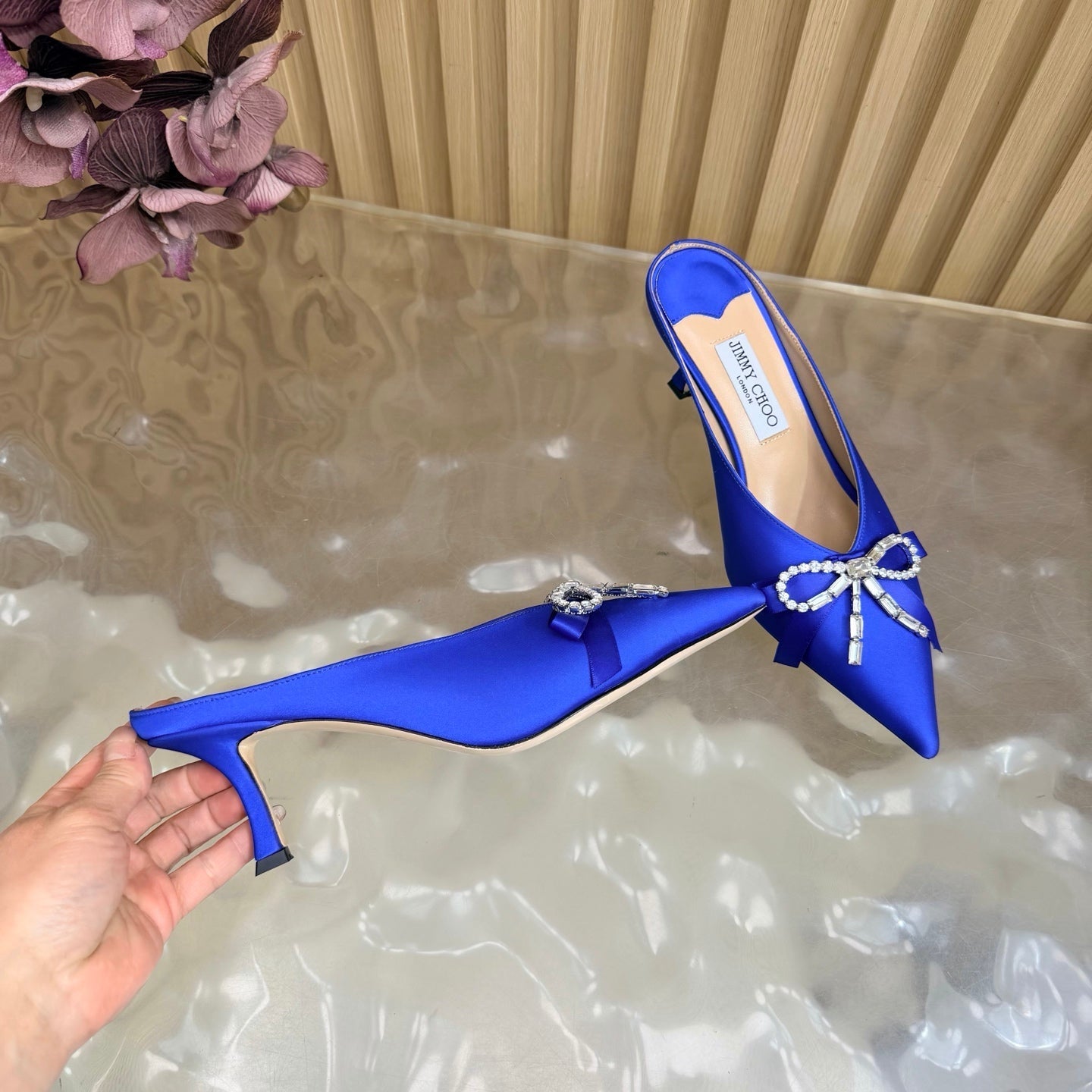 JIMMY CHOO 26S HIGH-HEELED MULES 65 MM IN NAVY BLUE SATIN WITH RHINESTONE BOW