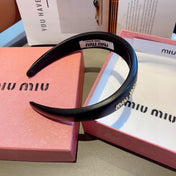 THICK HEADBAND IN BLACK CALFSKIN GOLD LOGO 409395