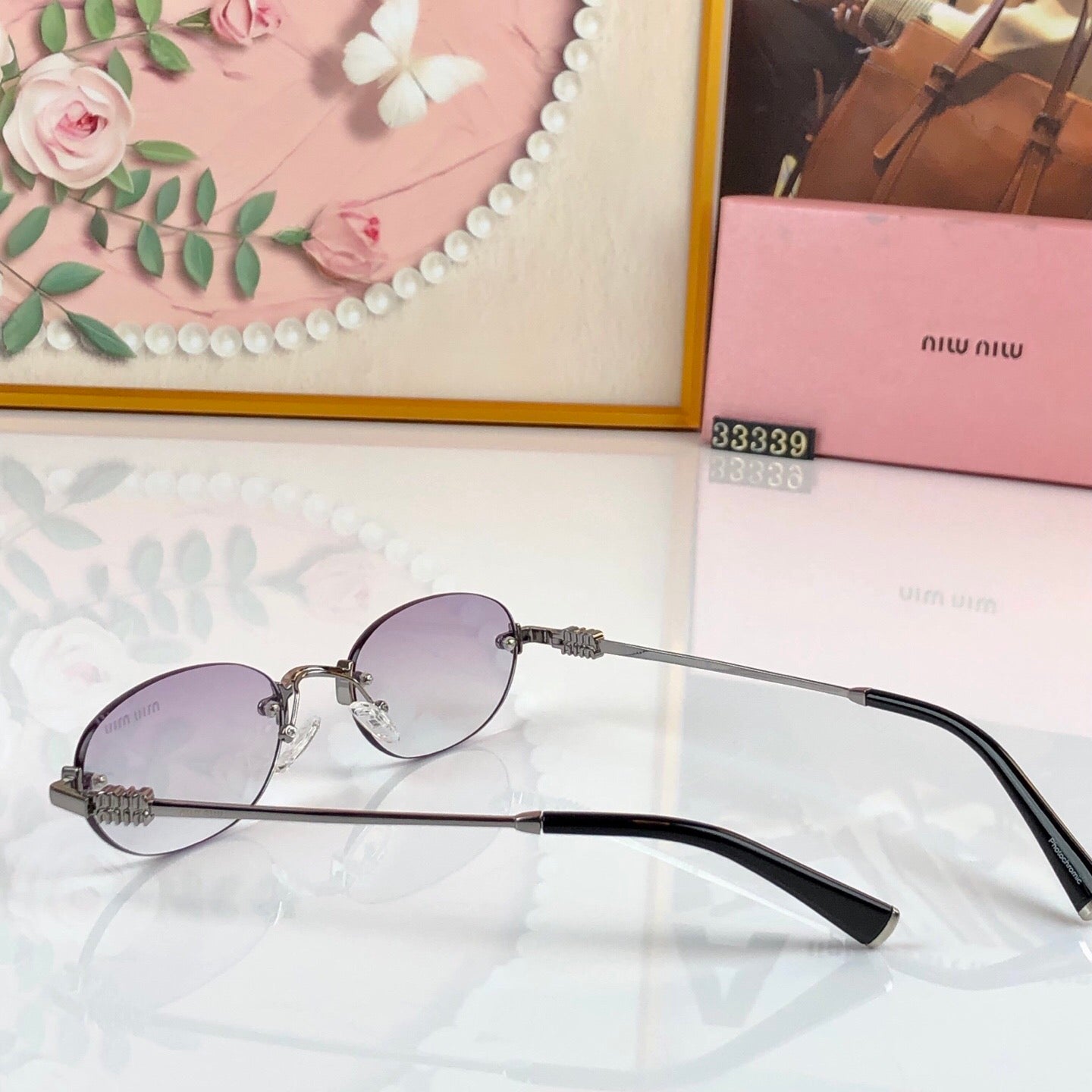 MIUMIU 26S RIMLESS OVAL FRAME IN METAL 436082