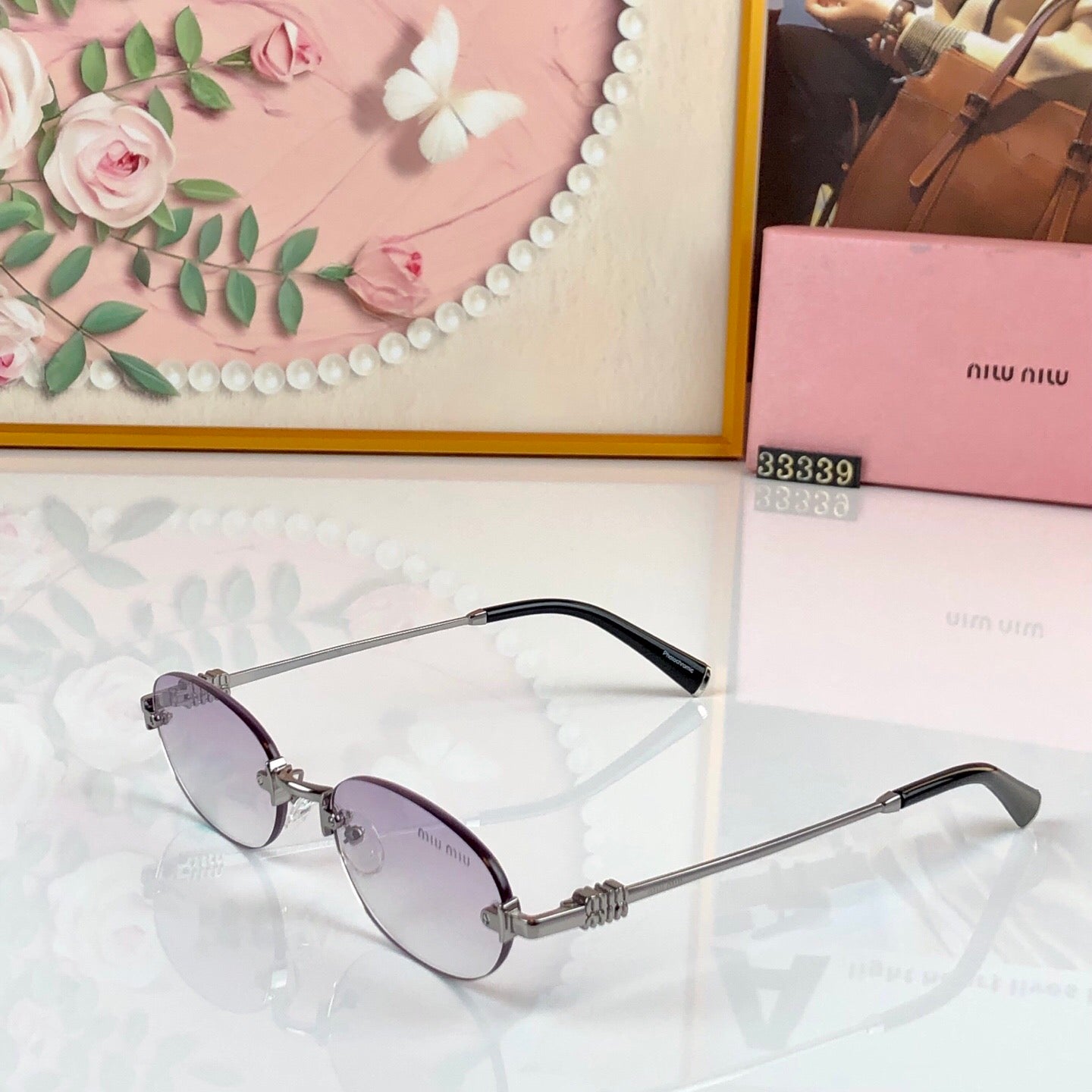 MIUMIU 26S RIMLESS OVAL FRAME IN METAL 436082
