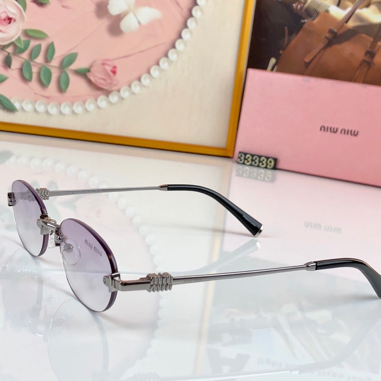 MIUMIU 26S RIMLESS OVAL FRAME IN METAL 436082