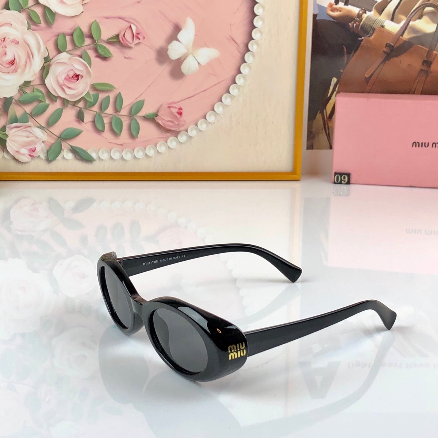 MIUMIU 26S OVAL FRAME IN ACETATE 426528