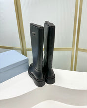 KNEE BOOTS WITH TRIANGLE LOGO IN BLACK CALFSKIN