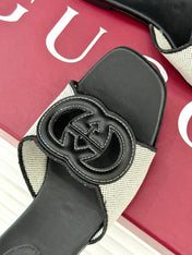 SLIDE SANDALS IN BLACK AND WHITE CALFSKIN