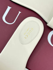 SLIDE SANDALS IN WHITE CALFSKIN WITH GOLD HARDWARE