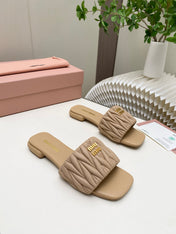 MIUMIU 26S MATELASSE SLIDES IN BEIGE CALFSKIN