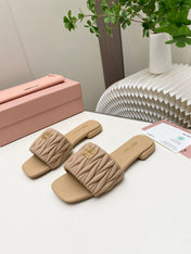 MIUMIU 26S MATELASSE SLIDES IN BEIGE CALFSKIN