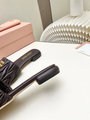 MIUMIU 26S MATELASSE SLIDES IN DARK BROWN CALFSKIN