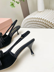 MIUMIU 26S SLINGBACK PUMPS 55MM IN BLACK SUEDE WITH BOW