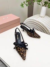MIUMIU 26S SLINGBACK PUMPS 55MM IN LEOPARD PRINT CALF HAIR WITH BOW