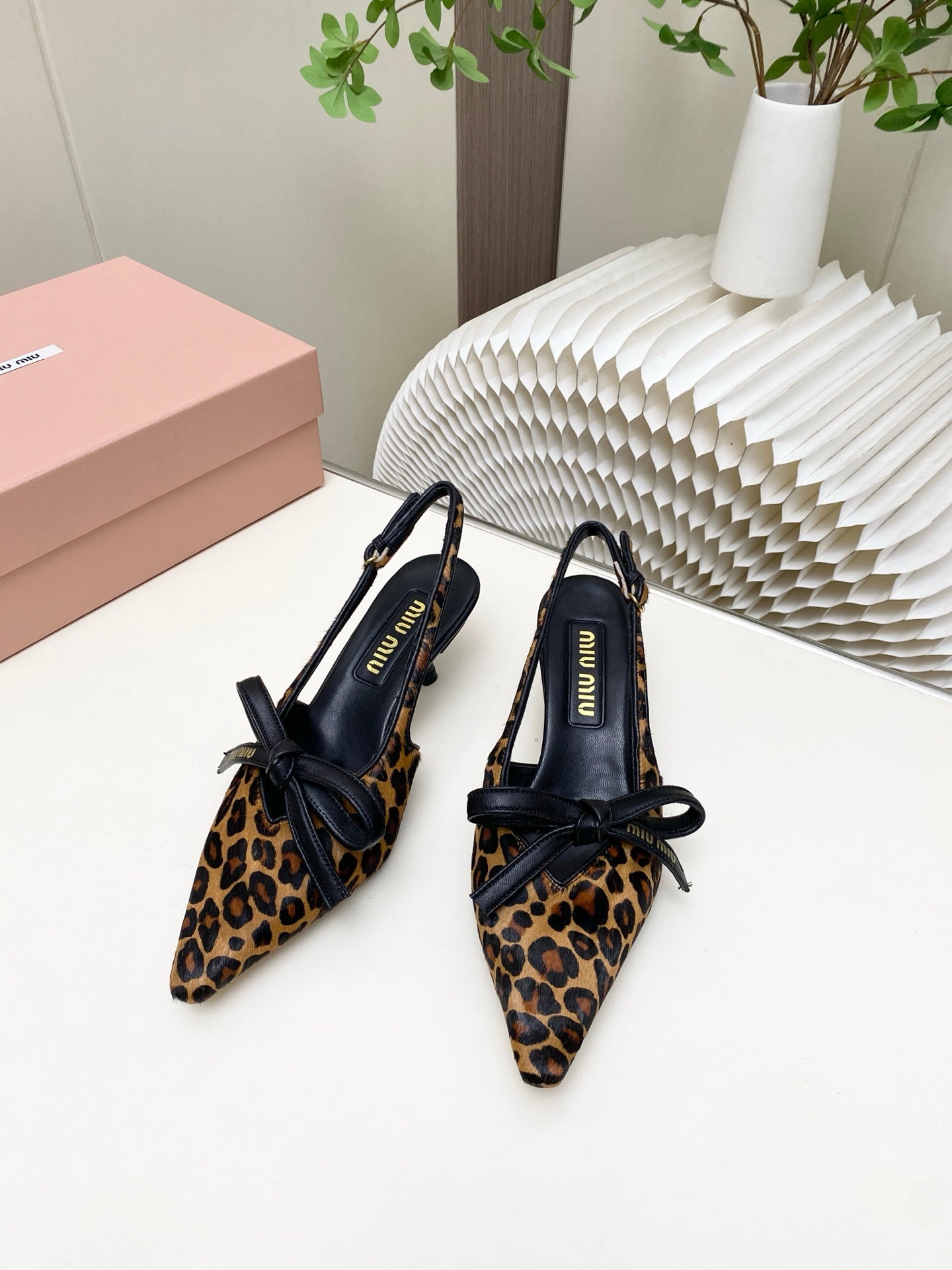 MIUMIU 26S SLINGBACK PUMPS 55MM IN LEOPARD PRINT CALF HAIR WITH BOW