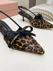 MIUMIU 26S SLINGBACK PUMPS 55MM IN LEOPARD PRINT CALF HAIR WITH BOW