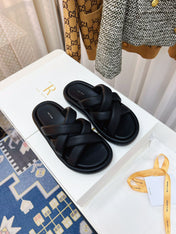 THE ROW 26S CROSSED PADDED SLIDES IN BLACK CALFSKIN