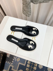 THE ROW 26S PIXEL APPLIQUE MULES IN BLACK CALFSKIN