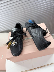 MIUMIU 26S GYMNASIUM SNEAKER IN BLACK CALFSKIN WITH GOLD BUCKLED STRAP