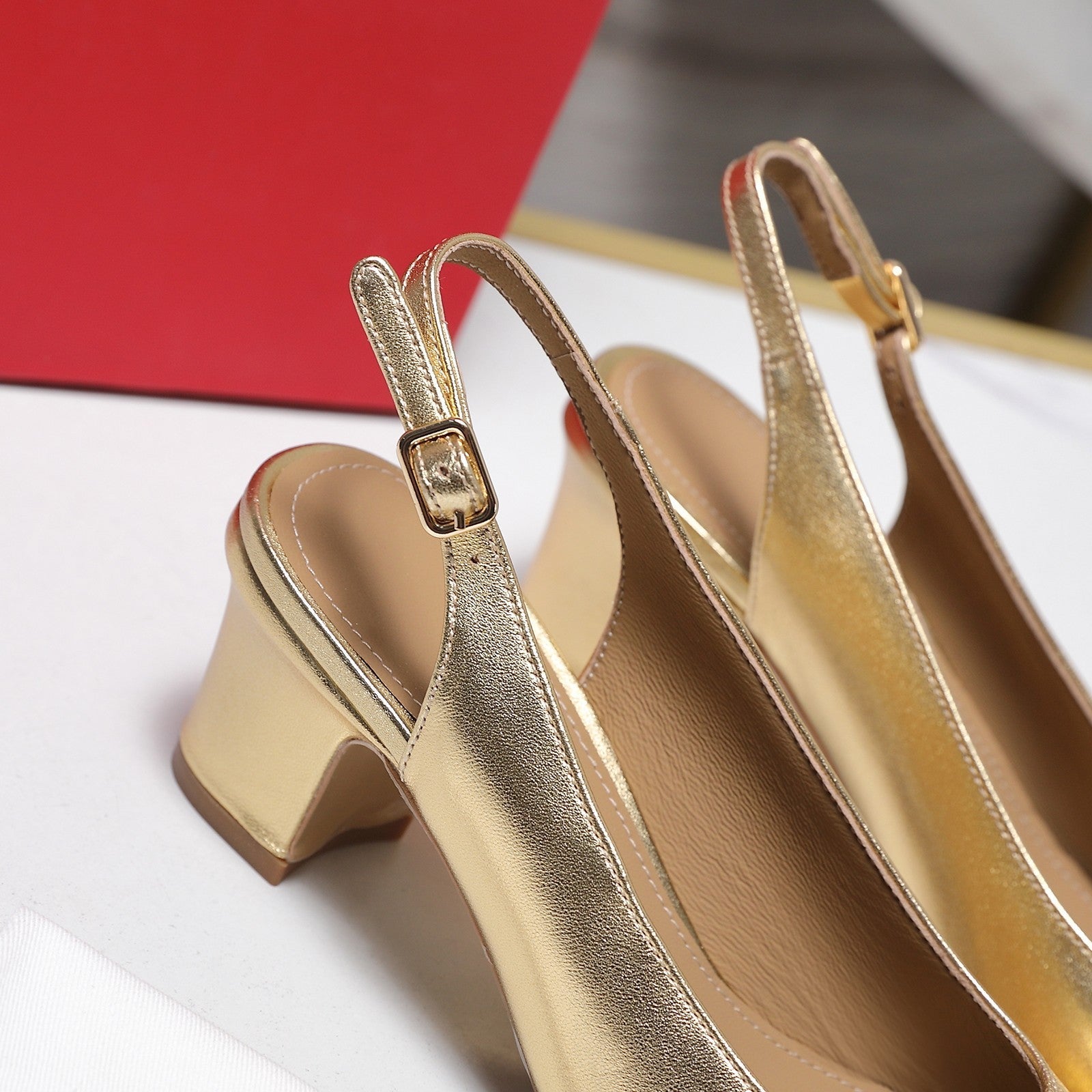 LV 26S SLINGBACK PUMPS 55MM IN GOLD PATENT CALFSKIN WITH BOW