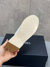 CHANEL 26S MULE LOAFERS IN WHITE CANVAS WITH QUILTED FLAP & CC LOGO