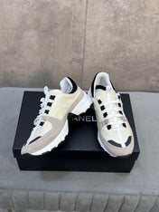 CHANEL 26S RUNNER CC LOGO SNEAKERS IN BEIGE AND GREY CALFSKIN