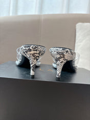 ALAIA HEELED THONG 25S 55 MM IN WHITE AND BLACK LAMBSKIN SNAKE-EMBOSSED WITH CLEAR STRAP