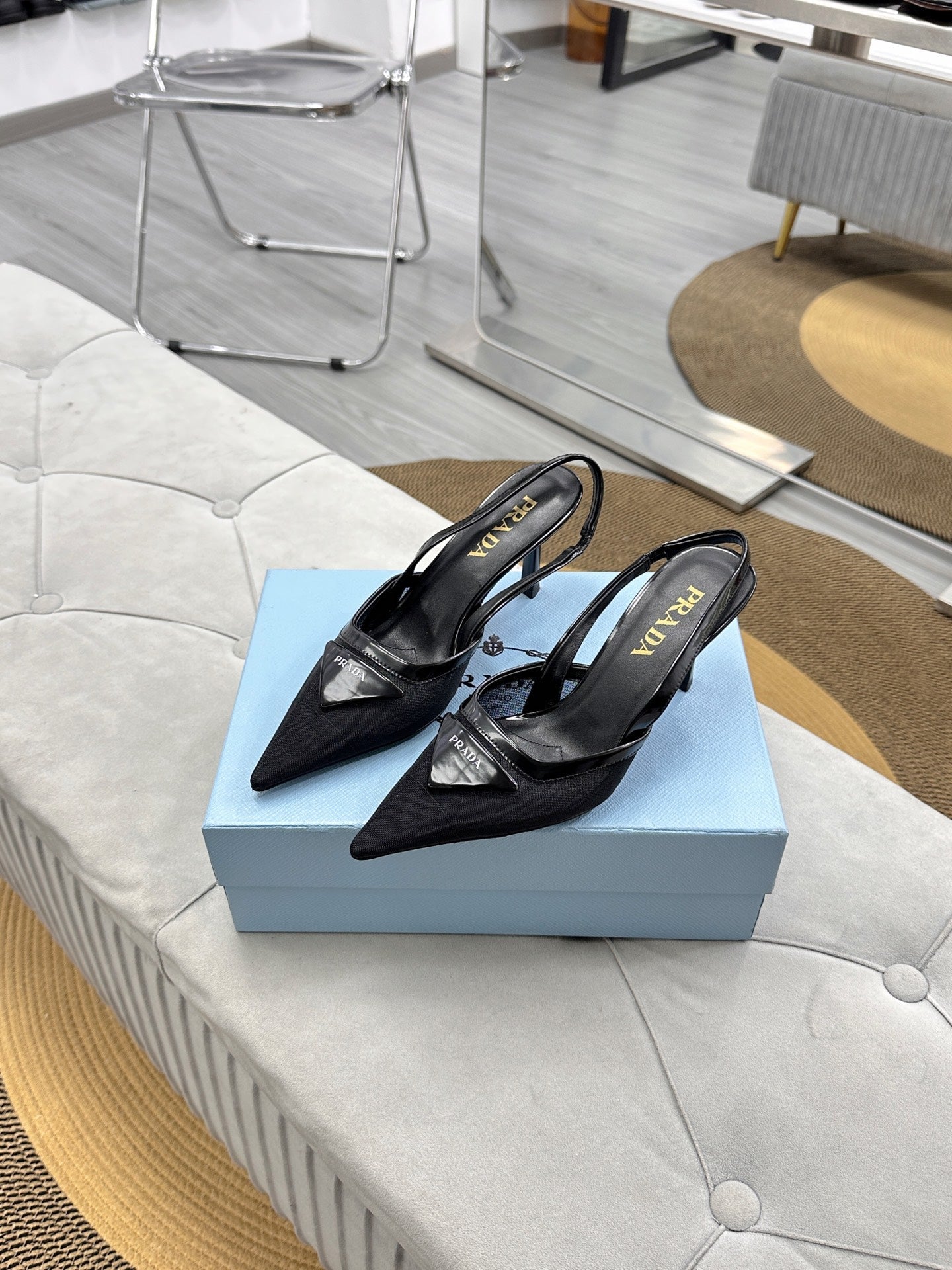 PRADA 25S TRIANGLE LOGO SLINGBACK PUMPS IN BLACK MESH FABRIC