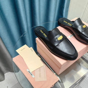 MULES SLIPPERS BLACK COWHIDE WITH GOLD COIN