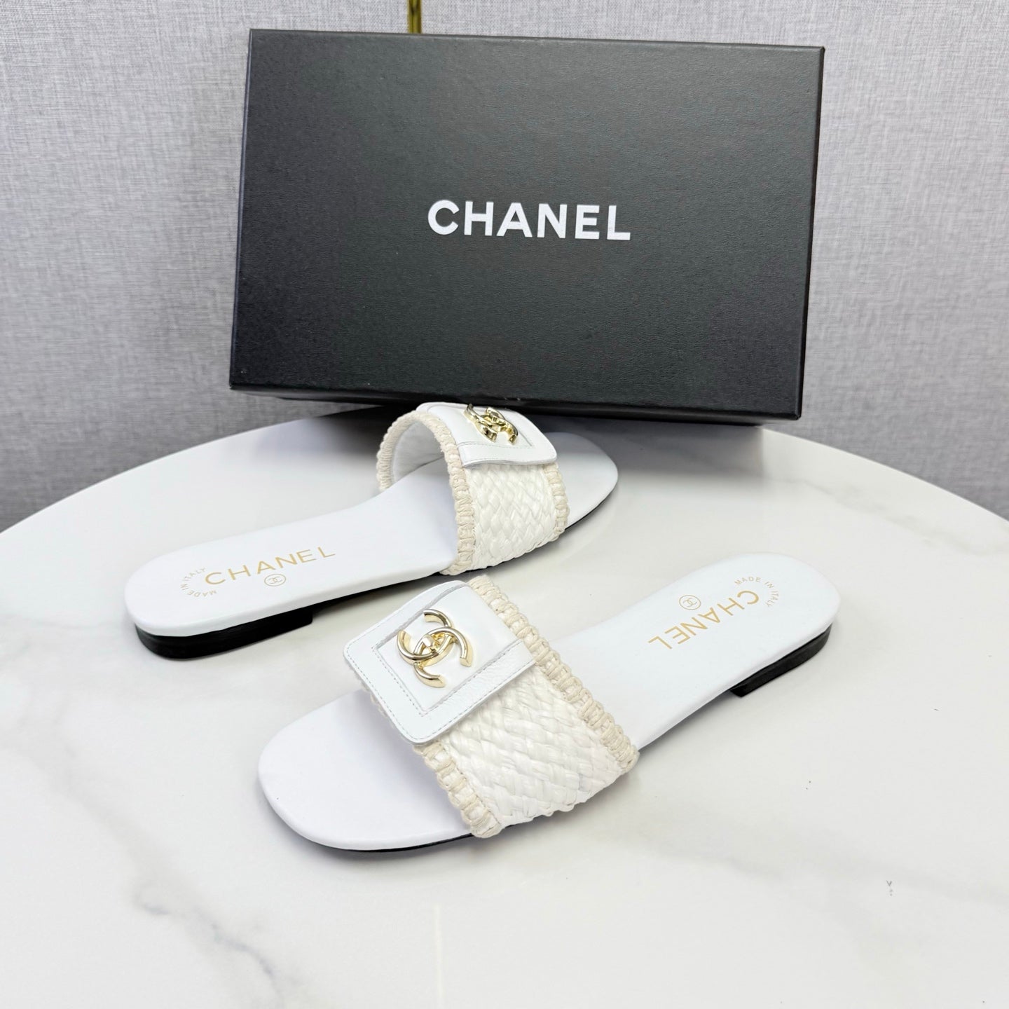 CHANEL 26S WOVEN STRAP SLIDES IN WHITE LAMBSKIN
