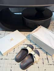 THE ROW 26S BUCKLE SLIDE SANDALS IN WHITE CALFSKIN