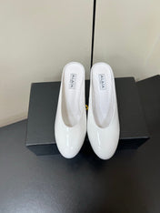 ALAIA WEDGE MULES 25S IN CREAM WHITE LAMBSKIN