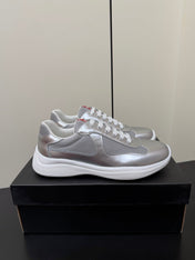 PRADA 26S SNEAKERS IN SILVER CALFSKIN AND WHITE MESH
