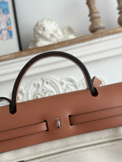 HERBAG ZIP 31 RETOURNE PEGASE POP BAG IN OFF-WHITE MIX RED CANVAS AND HUNTER COWHIDE